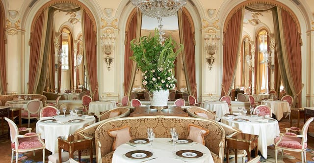 Ritz Paris banquet hall with elegant floral centerpiece for luxury social events and luncheons.