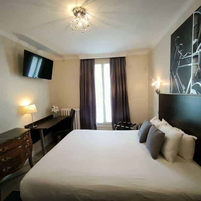 Boutique hotel suite with desk for solo business travel and event accommodation.