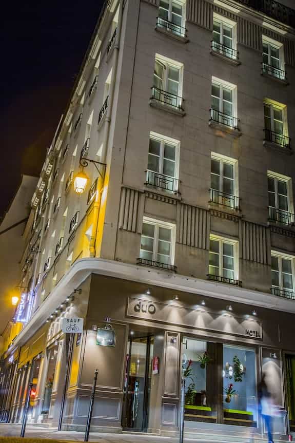 Hôtel Duo boutique hotel exterior with atmospheric evening lighting for luxury site visits.