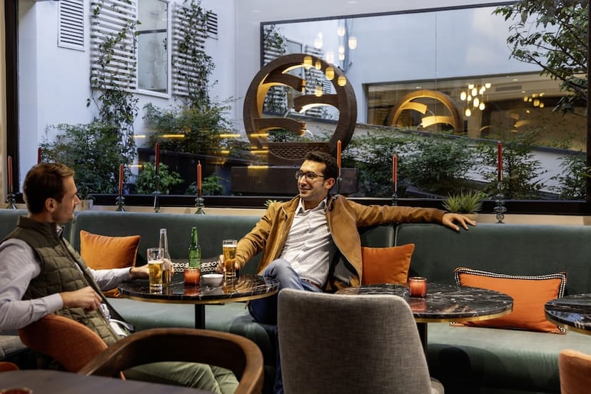 Casual networking garden at Hôtel Étoile Maillot with plush seating for intimate corporate events.