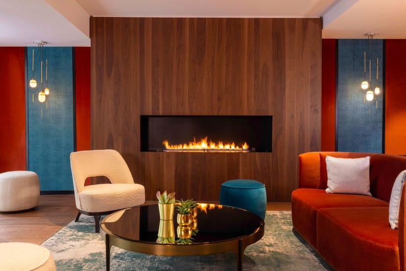 La Verrière lounge with fireplace: VIP networking and executive consultation event space.
