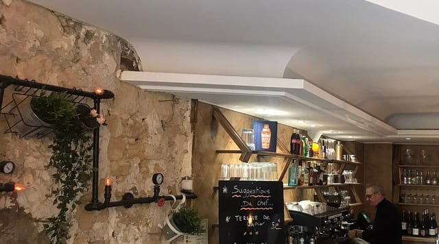 Rustic stone and industrial restaurant venue for networking mixers and welcome receptions.