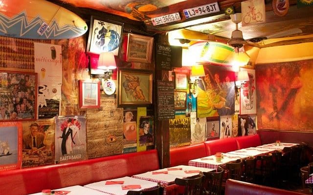 Eclectic restaurant at Hôtel les Artistes for intimate group dining and casual event venue.