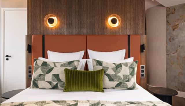 Luxury hotel suite with bedside lighting for VIP speakers and incentive travel.