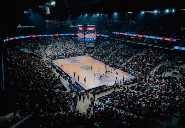 Adidas Arena interior with tiered seating and AV rig for live concerts and sporting events.