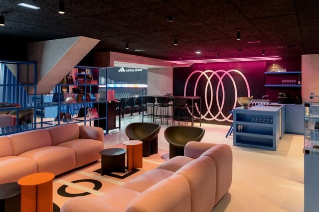 Loge Panorama VIP suite at Adidas Arena: corporate networking hospitality space with stadium views.