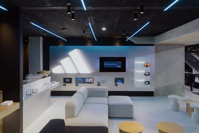 VIP corporate lounge at Adidas Arena with modular seating for premium networking and events.