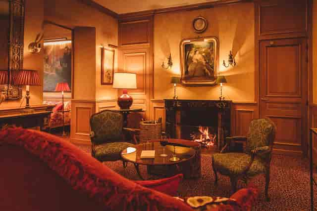 Lounge at Hôtel de l’Abbaye Paris with fireplace for VIP breakout sessions and private meetings.