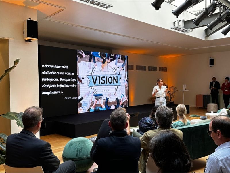 Paris corporate presentation with LED wall and lounge seating for professional business events.