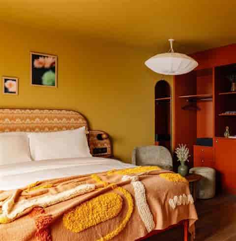 Boutique hotel room at Roseraie Suite, Jardin des Plantes, perfect for executive retreats and VIPs.