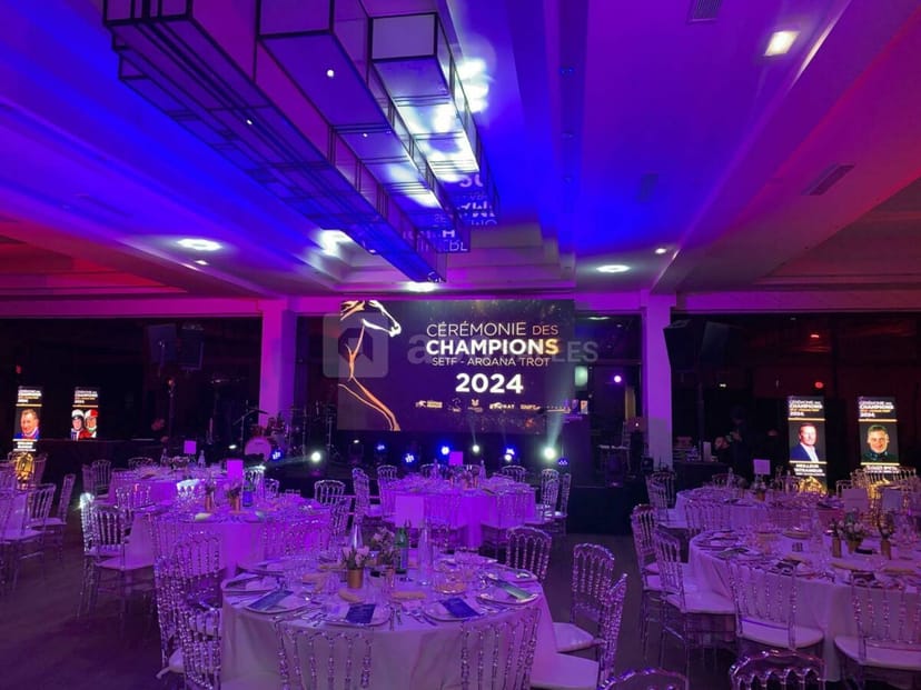 Le Salon Toffoli gala setup with purple lighting for corporate awards ceremony event.