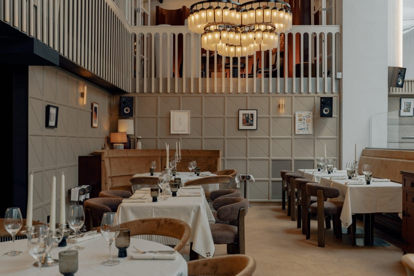 Upscale tiered seating for corporate dinner or executive breakout at Temple & Chapon restaurant.
