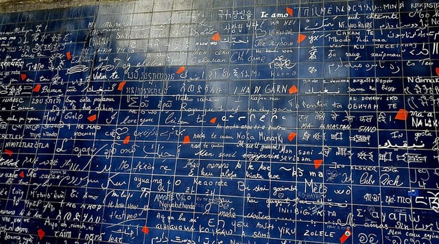 "I Love You" wall in Paris: interactive multilingual art installation for event engagement.