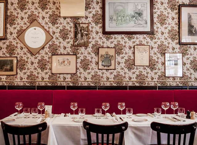 Benoit restaurant banquet seating, vintage gallery wall for private dining and corporate events.