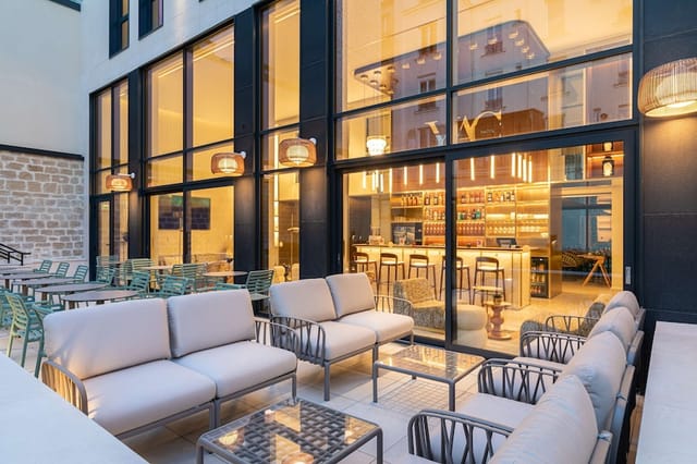 Stylish bar at Hotel YAC Paris Clichy for upscale cocktail hours and corporate networking events.