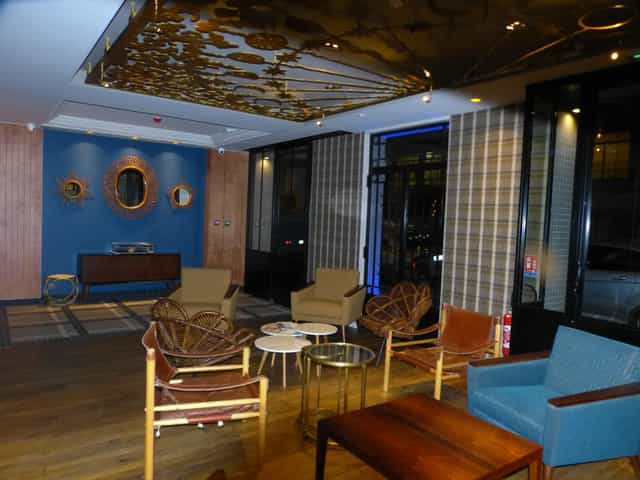 Boutique hotel lounge with chic seating, ideal for professional networking and small workshops.
