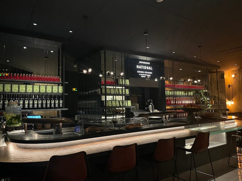 Sleek L’Herbarium bar setup for high-end corporate cocktail reception and networking event.