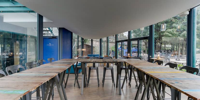 Grand Bleu nightclub with high-top tables, perfect for corporate networking and social events.