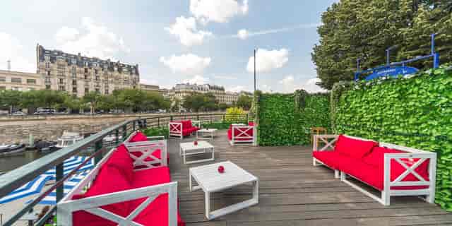 Upscale cocktail reception on Grand Bleu terrace with lounge seating for networking events.