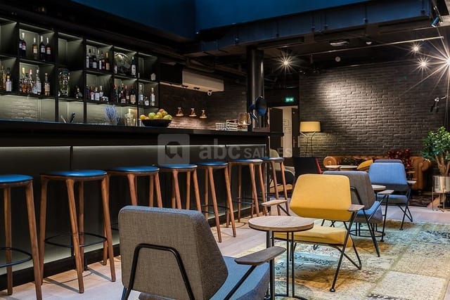 Modern industrial-chic lounge bar for corporate networking and cocktail events.