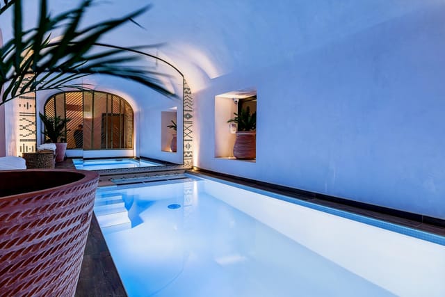 Luxury hotel indoor spa pool for VIP incentive retreat or corporate wellness event.