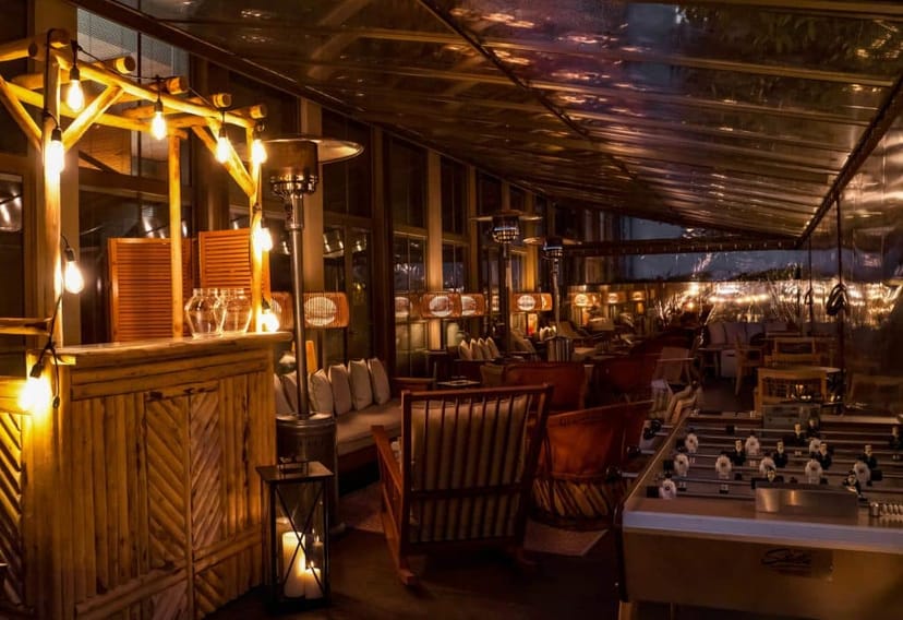 BRACH hotel terrace with plush seating and foosball table for corporate networking and team building.