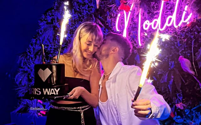 Back Bar Noddi event featuring neon sign and floral wall for nightlife and brand activations.