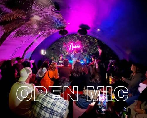 Back Bar in Noddi: neon-lit lounge, perfect for corporate mixers and private social events.