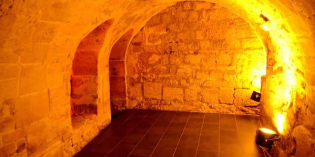 Vaulted stone space in Noddi, perfect for historic architecture event and intimate reception venue.