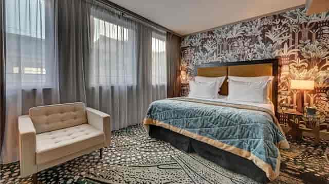 Boutique guest room at The One Alma Paris with premium design for VIP event lodging.
