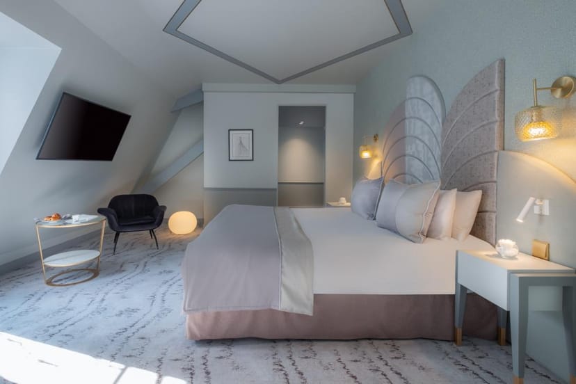 Upscale boutique guest room at The One Alma Paris for corporate travel and VIP executive housing.