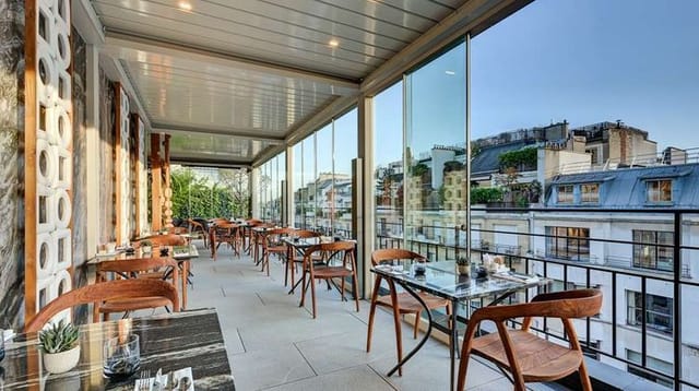 Retractable roof terrace bar at The One Alma Paris for luxury cocktail receptions and dinner events.