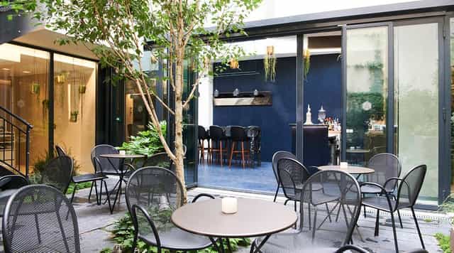 Lobby event space at Hôtel Perpetual Paris with patio for networking and cocktail receptions.