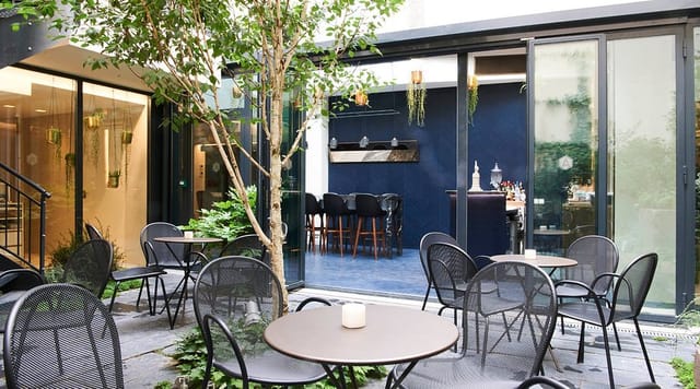 Lobby event space at Hôtel Perpetual Paris with patio for networking and cocktail receptions.