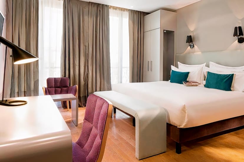 Modern hotel room with workspace for VIP guest accommodation and event speaker lodging.