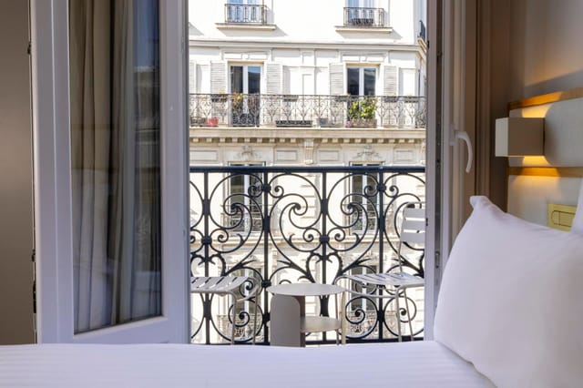Luxury hotel room with Parisian balcony for corporate incentive travel and VIP executive events.