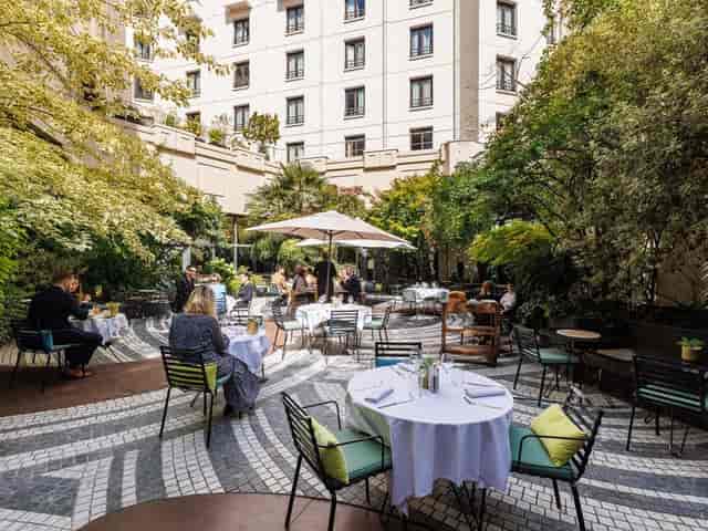 Upscale urban courtyard restaurant for professional networking and corporate events.