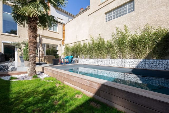 Outdoor poolside venue for boutique corporate retreats and networking mixers.