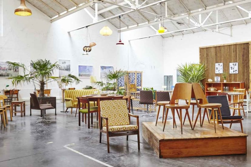 Industrial-chic venue in In-Sted with a stage for corporate events and brand activations.