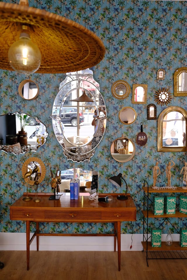 Espace Photo gallery wall with eclectic mirrors for boutique pop-up events and experiential spaces.