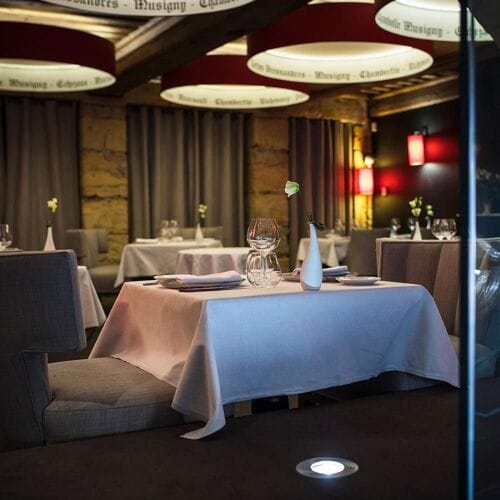 Upscale Burgundy restaurant dining setup for exclusive corporate dinners and VIP events.