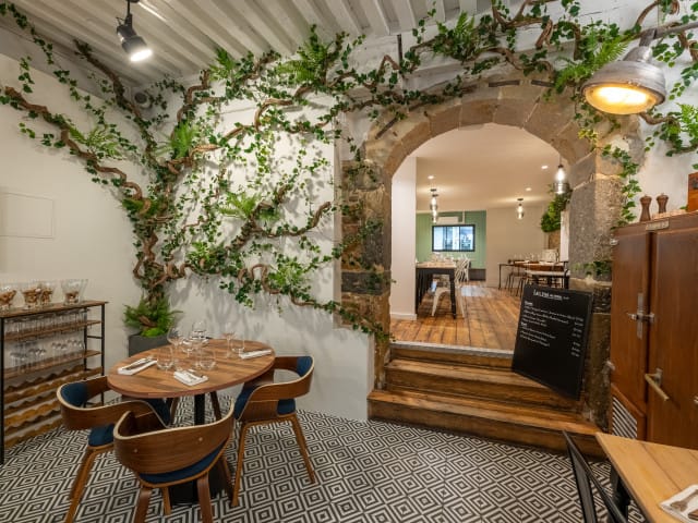 Rustic-chic VIP dinner space at Maison Moly with stone architecture for private events.