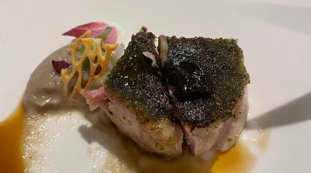 High-end plated entree at Maison Moly gala dinner, modern culinary presentation.