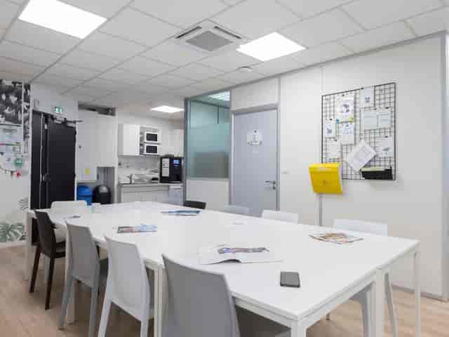 Focus Coworking meeting room with refreshment bar for team huddles and breakout sessions.