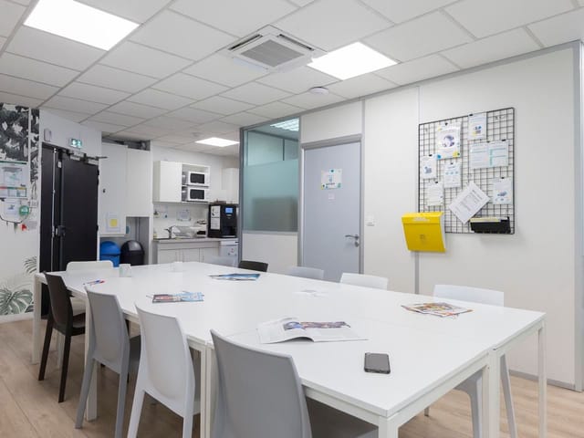 Focus Coworking meeting room with refreshment bar for team huddles and breakout sessions.