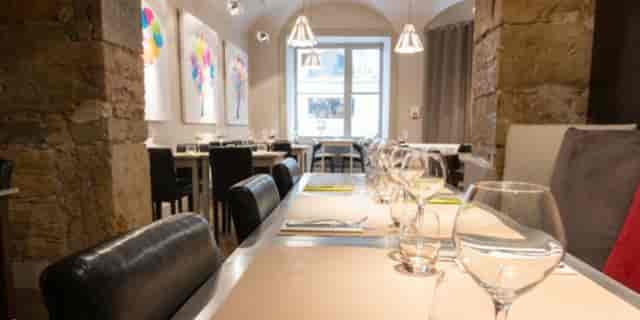 Vaulted stone restaurant for VIP board dinners and high-end breakout lunches.