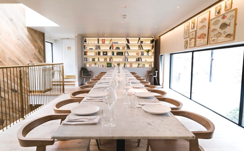 Lurra first-floor marble dining table for intimate private dining and corporate board meetings.