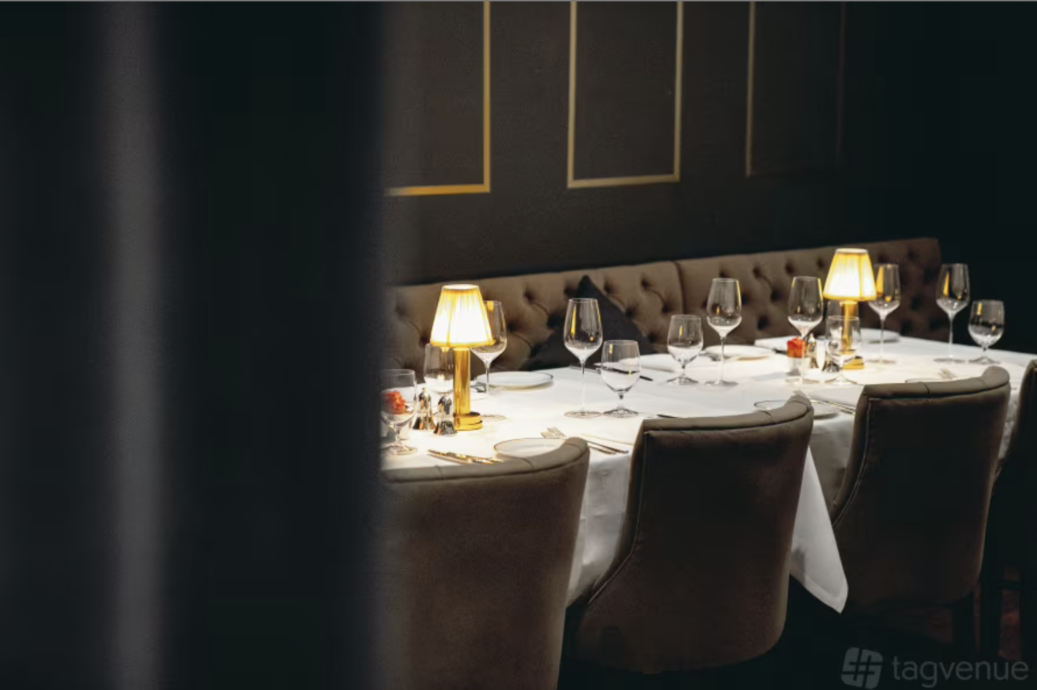 Executive board dinner at The Tap Room: upscale tufted banquettes, private dining event.