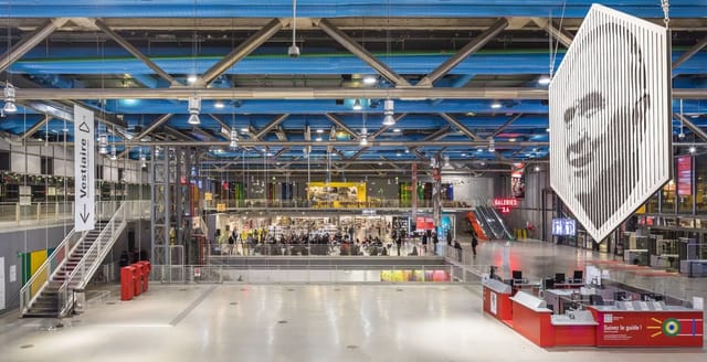 Industrial Forum at Centre Pompidou with open-plan layout for trade shows and event registration.