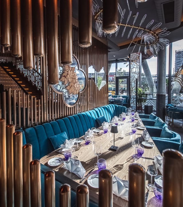 Ommia luxury dining venue with velvet seating, ideal for upscale boardroom dinners and events.